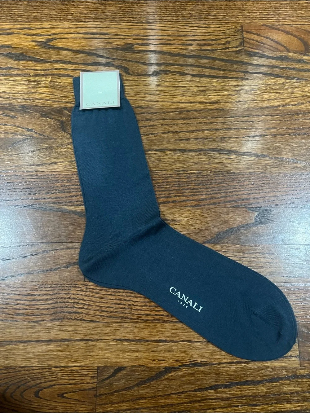 Canali dress socks featuring the brand's logo printed along the side.
